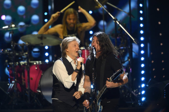 Paul McCartney and Dave Grohl perform during the Rock & Roll Hall of Fame induction .