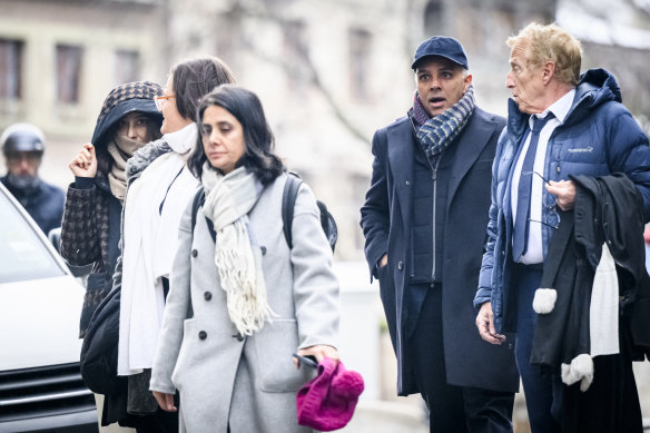 Billionaire family members Namrata Hinduja (left) and Ajay Hinduja (second from right) arrive at the Geneva’s courthouse with their lawyers.