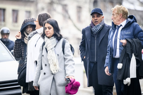 Billionaire family members Namrata Hinduja (left) and Ajay Hinduja (second from right) received four-year sentences.