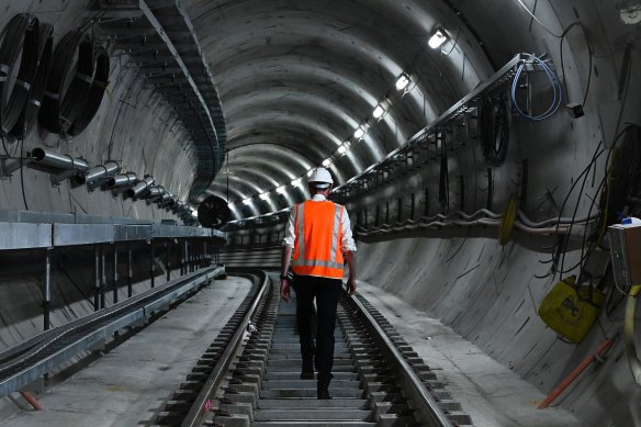 Premier Dominic Perrottet walks the metro track at Martin Place. Four new Sydney Metro lines are planned for western Sydney. 