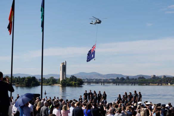 Flypast during the flag raising and citizenship ceremony at Rond Terrace in Canberra .