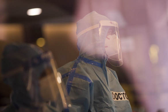 A doctor is seen at a banquet hall that was converted into a COVID-19  isolation centre to handle the rising cases of infection in Delhi, India. 