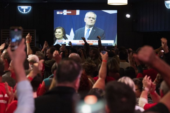 Labor supporters cheer as Scott Morrison concedes defeat on May 21, 2022.