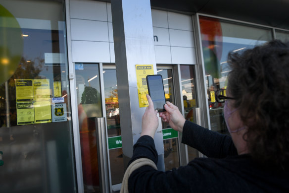 A customer scans a QR code at Woolworths in Preston.

