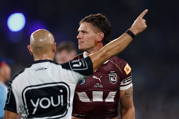 Kalyn Ponga of the Maroons is sent from the field by referee Ashley Klein.