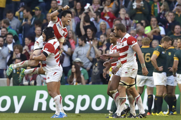 Japan's Brave Blossoms celebrate their upset win over South Africa at the 2015 Rugby World Cup.