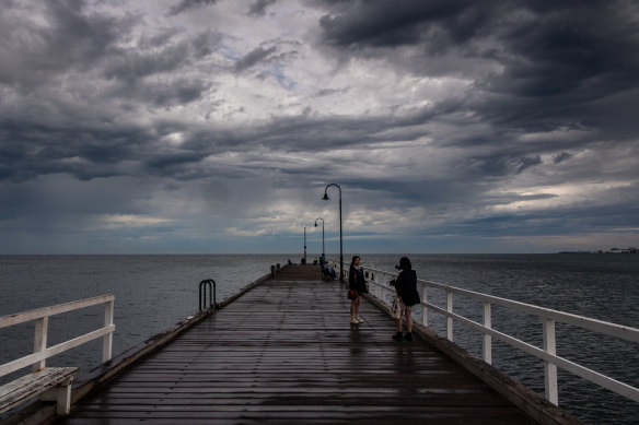 Storm clouds gather over Port Philip Bay at St Kilda ahead of heavy rain.