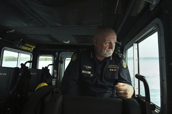 Australian Border Force (ABF) regional commander of Northern command Colin Drysdale on a fast response boat patrolling off Thursday Island.