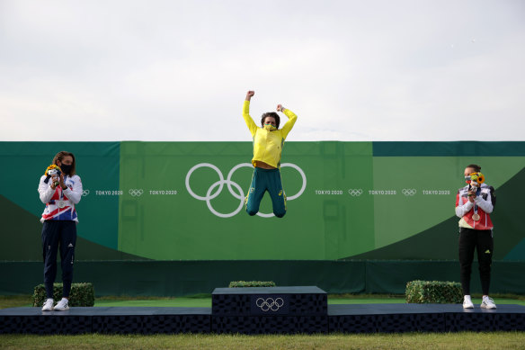 Jessica Fox celebrates on the podium.