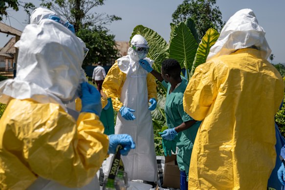 Health workers suit up during an Ebola outbreak in the mining town of Mongbwalu, Democratic Republic of the Congo, on May 25, 2026.