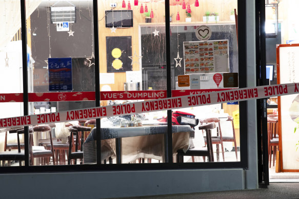 Police tape cordons off a restaurant in Auckland, New Zealand after an axe attack late on Monday. 