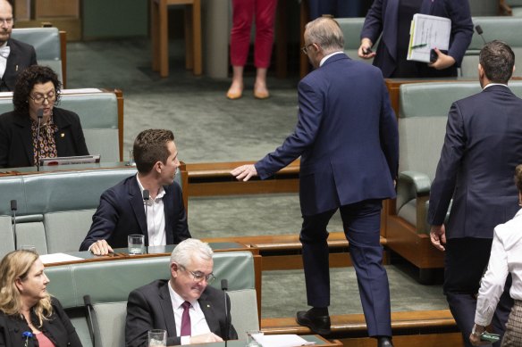 Prime Minister Anthony Albanese walks past Greens housing spokesman Max Chandler-Mather in 
 parliament.
