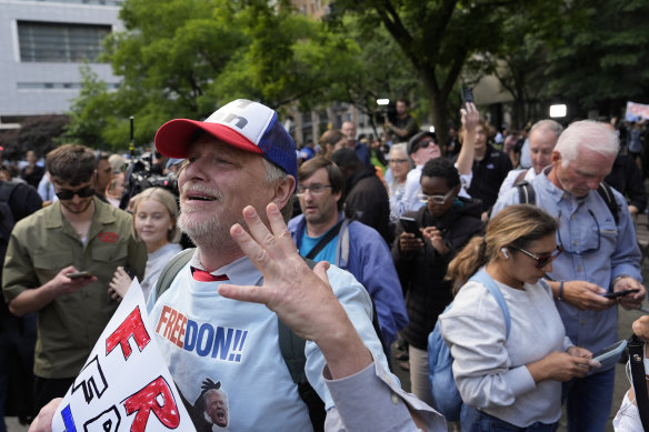 A supporter of Donald Trump reacts to the guilty verdict announced against the former president outside Manhattan Criminal Court.