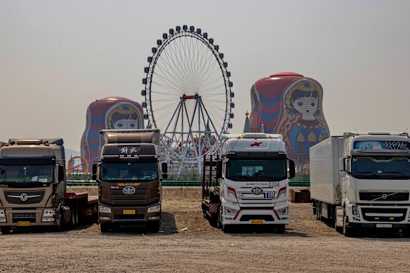 Trucks from Russia and Belarus wait for custom clearance at a parking lot in Manzhouli, a Chinese town on the border of Russia. 