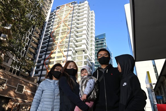 Ben Xue, second from right, and his family outside the Imperial towers.