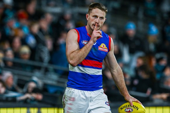 Will Lewis quiets the crowd after marking on the final siren in Adelaide.