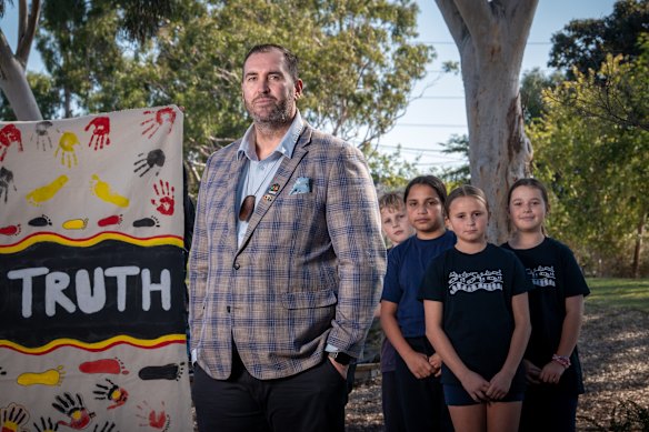 Lovett and students at Reservoir East Primary School.