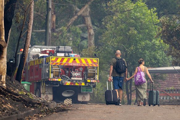 Mike and Katie Green return on Sunday morning to their new home, which stood up to the fire.