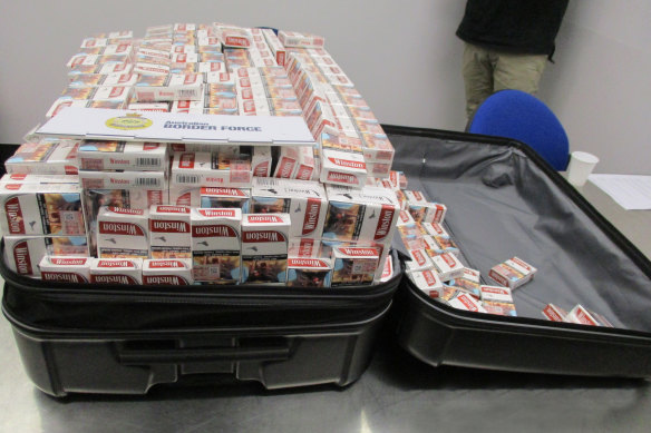 A suitcase full of cigarette packets seized last year by Australian Border Force.