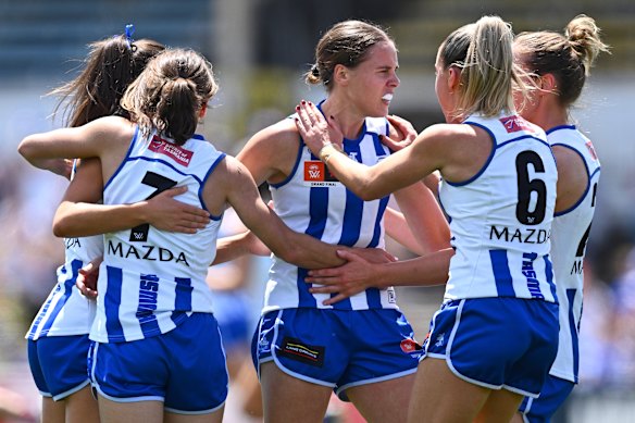 Jasmine Garner celebrates with Kangaroos teammates.