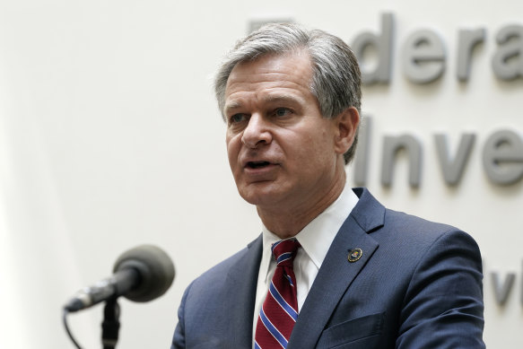 FBI Director Christopher Wray speaks during a news conference.