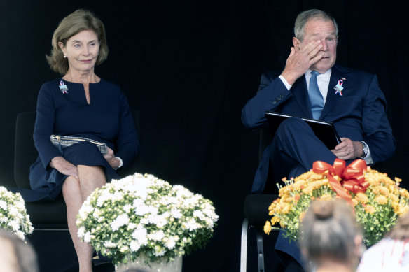 Former President George W. Bush, right, wipes his eyes next to former first lady Laura Bush, after he spoke at a memorial for the passengers and crew of United Flight 93 on September 11, 2021.