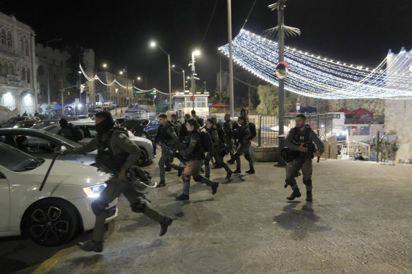 Israeli Border Police are deployed near the Damascus Gate to the Old City of Jerusalem during a raid by police at the al-Aqsa Mosque compound on Wednesday.