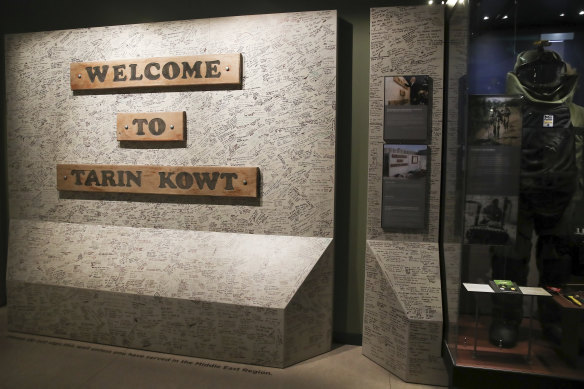 The Afghanistan exhibition at the Australian War Memorial includes a wall signed by thousands of veterans who served in Tarin Kowt.