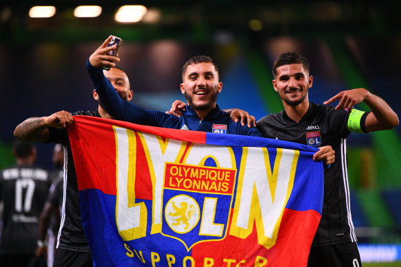 Memphis Depay, Rayan Cherki and Houssem Aouar celebrate Lyon's success.