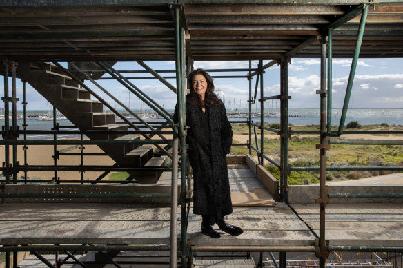 Patricia Ilhan among the scaffolding of her new home in Brighton.