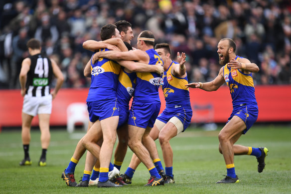 Shannon Hurn, centre, celebrates with teammate Jeremy McGovern, Tom Barrass, Tom Cole, Elliot Yeo and Will Schofield after winning the 2018 grand final. 