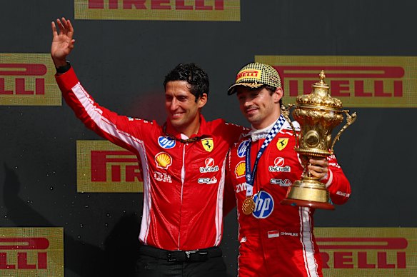 Race winner Charles Leclerc of Monaco and Bryan Bozzi, Scuderia Ferrari race engineer celebrating on the podium.