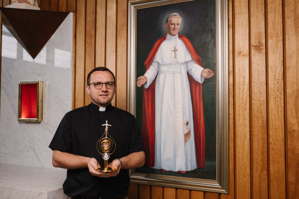 Father Greg Skulski, priest at St Patrick’s Catholic Church in East Gosford, picutred with a relic of Saint John Paul II’s hair, as part of a shrine to the former Pope, being installed on October 22.
