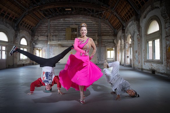 Rising artistic director Hannah Fox, centre, with breakdancers Michael Fox and Demi Sorono in the Flinders Street Station ballroom. 