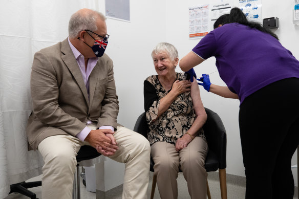 Then-prime minister Scott Morrison receives the first COVID-19 vaccines in Australia with aged care resident Jane Malysiak.