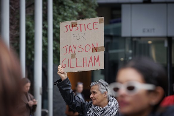 A supporter of pianist Jayson Gillham outside the Federal Court in May.