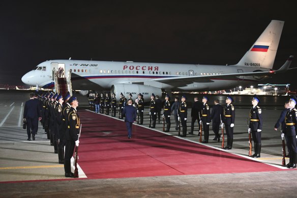 Russian President Vladimir Putin, centre back to a camera, arrives to meet released Russian prisoners at the Vnukovo government airport outside Moscow, Russia.