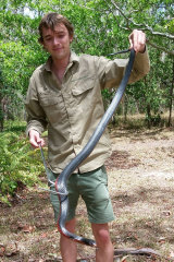 Sunshine Coast snake catcher Luke Huntley with a red-bellied black snake.
