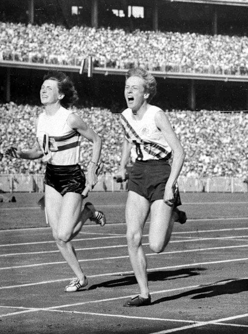 Betty Cuthbert (right) wins the 4 x 100-metres relay final in a new world record time of 44.5 seconds in Melbourne, 1956.