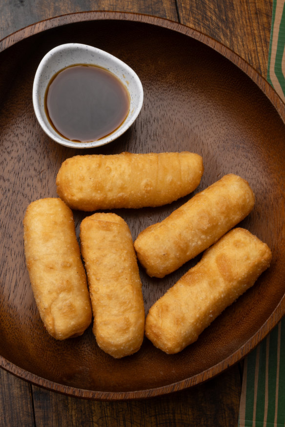 Tequenos (fried cheese pastries).