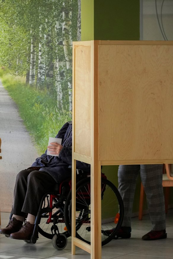 A voter leaves a polling booth at a polling station in Turku, Finland.