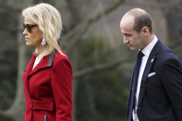 Kellyanne Conway and Stephen Miller walk on the South Lawn of the White House before boarding Marine One.