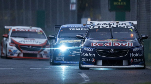 Head to head: Jamie Whincup leads Scott Pye into turn three during race 3 of the Supercars Melbourne 400 at Albert Park.