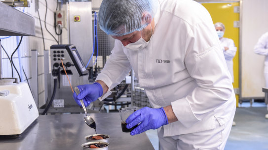 A chef from French chef Alain Ducasse’s team prepares a low-temperature cooked salmon for the French astronaut Thomas Pesquet at the canning factory Henaff in Pouldreuzic, near Brest, western France.