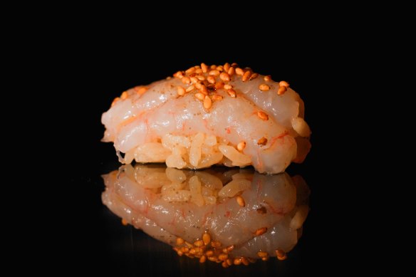 Nigiri is served alongside cocktails.