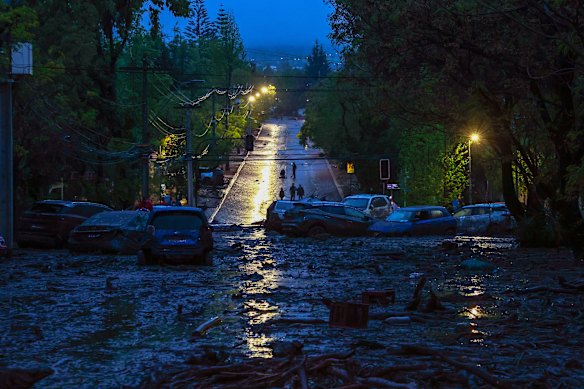 A flooded street of Las Condes with wrecked cars after heavy rains hit Chile’s capital in Santiago, Chile.