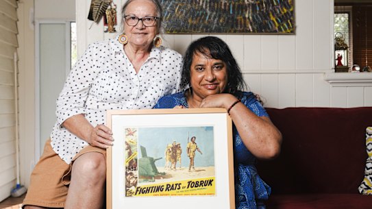 Black Rat of Tobruk Archibald Driscoll’s daughter-in-law Colleen Hurley and granddaughter Angelina Hurley with the movie poster he features in.
