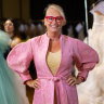 Former lord mayor Sally Capp, wearing a design by Mastani, is preparing to walk the runway in the Melbourne Fashion Festival. 