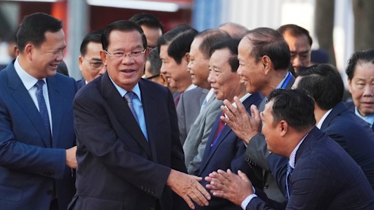 Cambodian Senate president Hun Sen, centre, and his son and prime minister Hun Manet in January. 