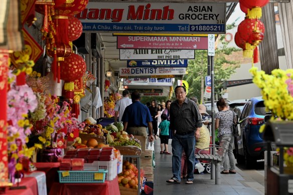 Shoppers walk along Chapel Road in Saigon Place in Bankstown, NSW. January 24, 2024. Photo: Kate Geraghty 